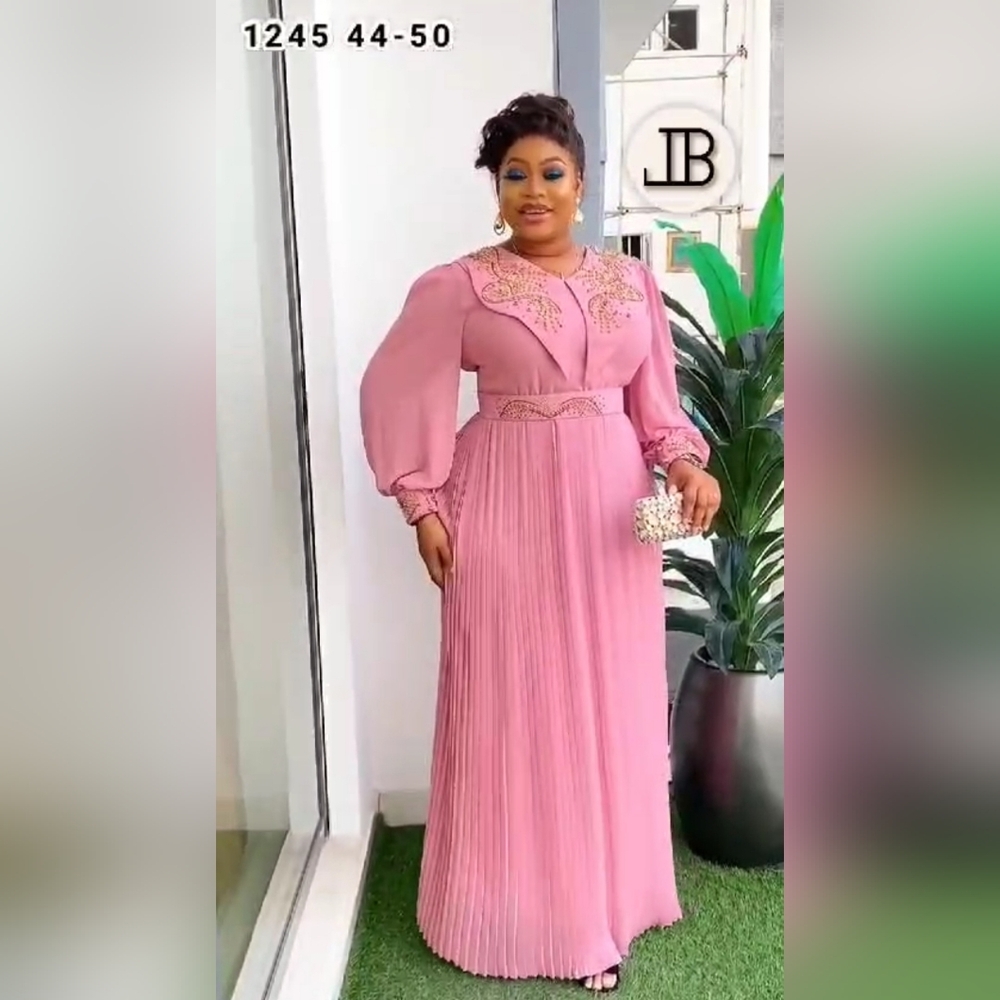 Pink long pleated dress with sequins lantern sleeve, wide collar.